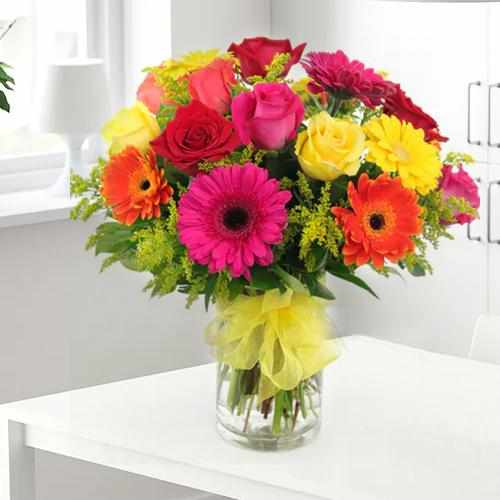 Mixed Gerberas Red and Yellow Roses in a vase