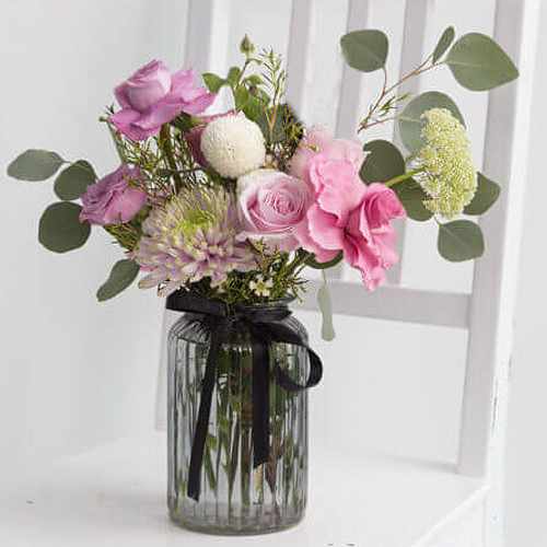 Arrangement of Soft Pink flowers in a Vase
