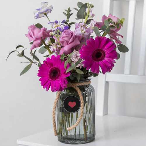 Purple Roses Gerberas and Eustomas in Vase